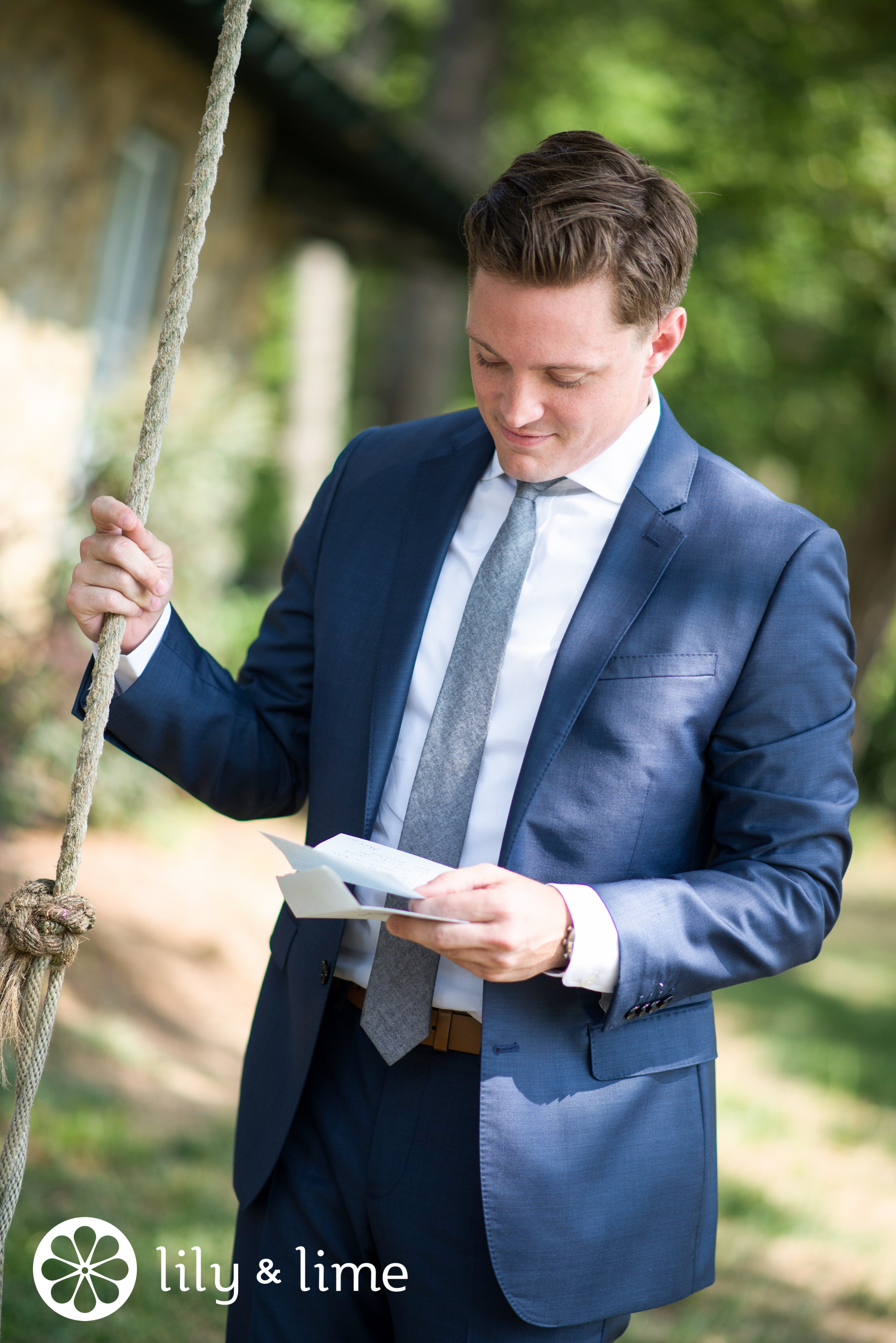 groom reading wedding day love note