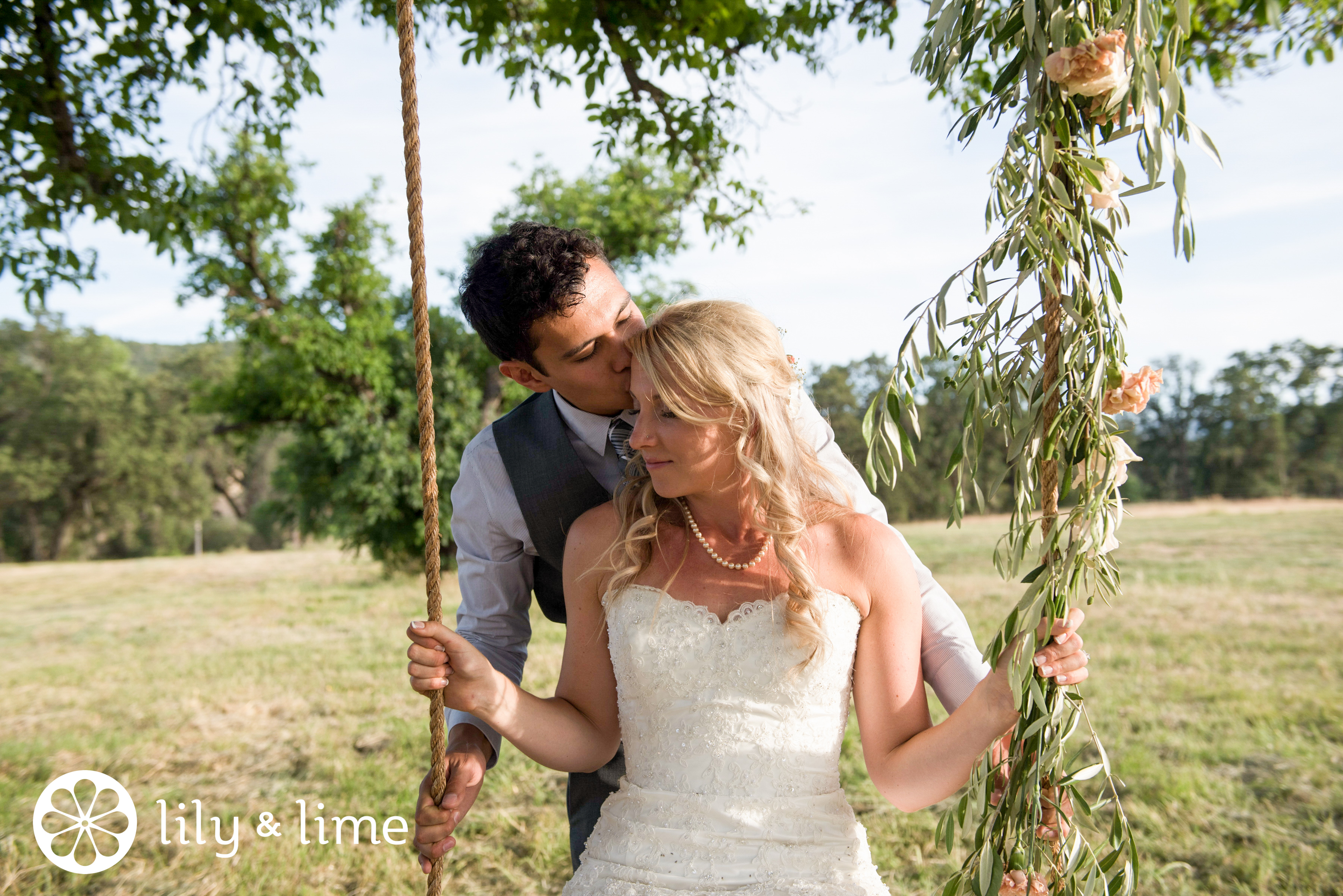 outdoor wedding photos on tree swing