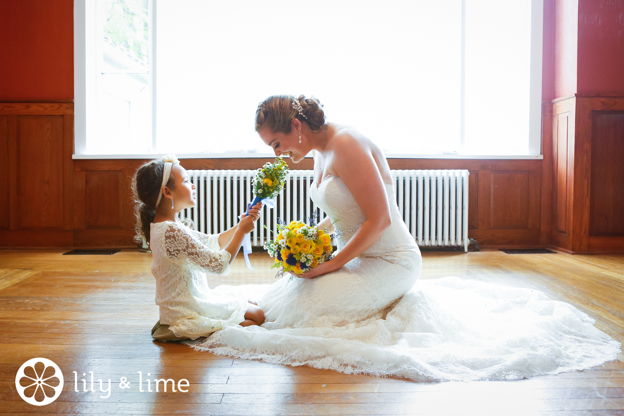 candid bride and flower girl wedding moment