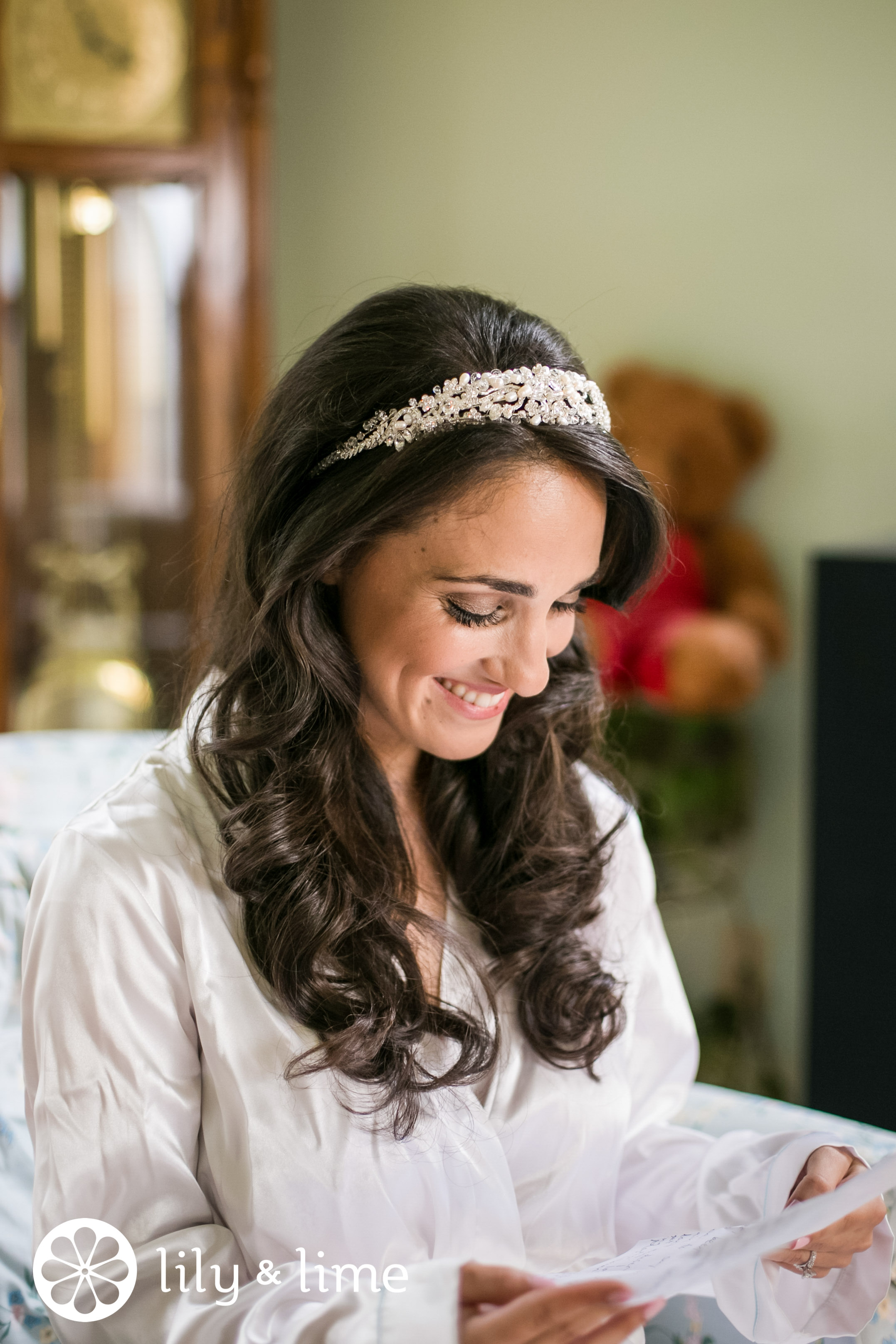 bride reading letter before wedding