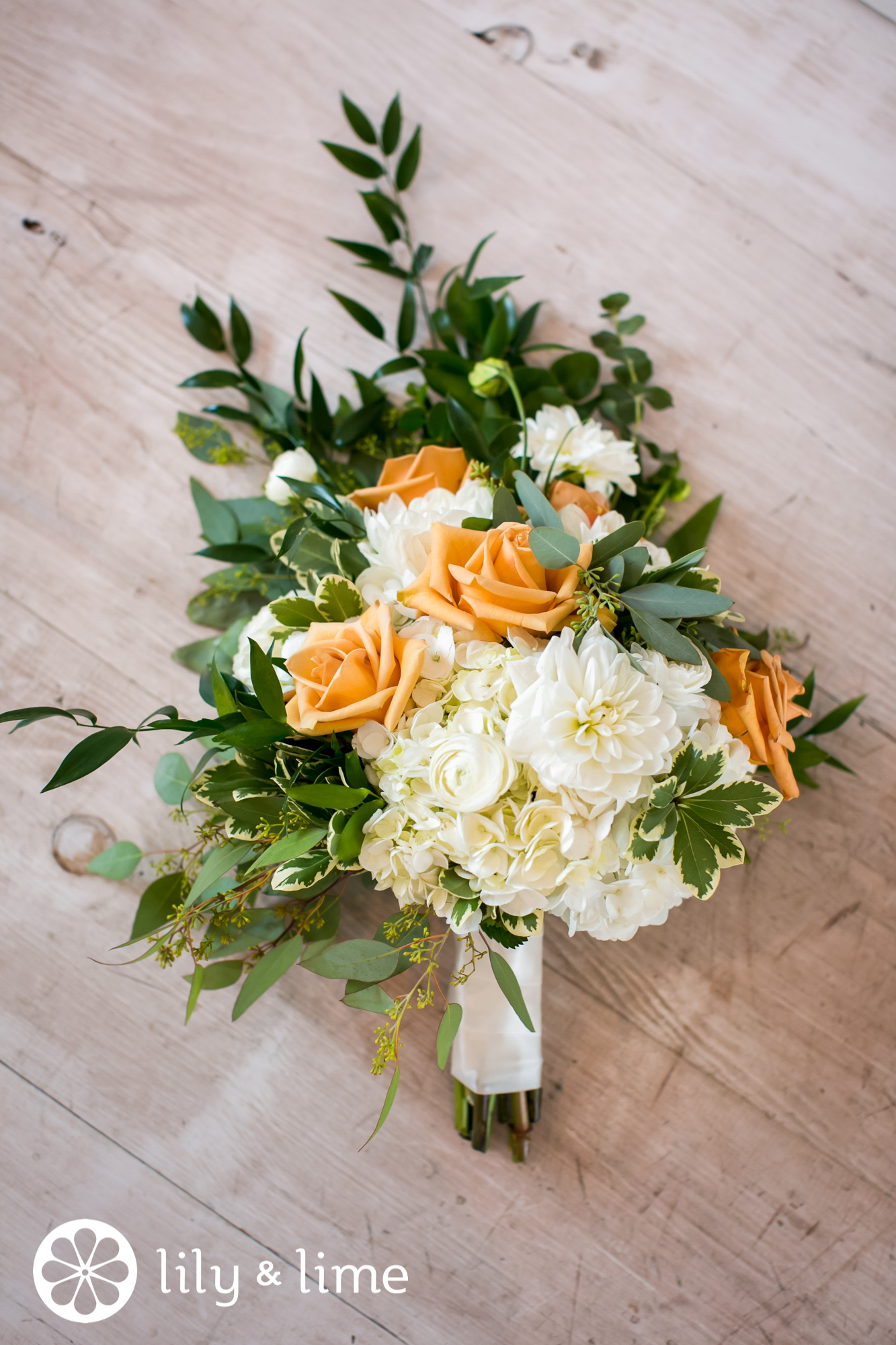 pastel orange rose wedding bouquet